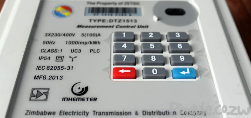 Person Recharging ZESA Electricity Meter