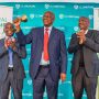 Minister of Finance, Patrick Chinamasa, rings the bell to signal the re-listing of Old Mutual on ZSE. Old Mutual Group CEO, Mr. Jonas Mushosho (left), and ZSE Deputy Chairperson, Bart Mswaka (right), applauding.