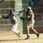 Soldier chasing a civilian in the streets