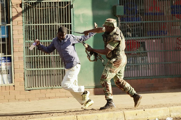 Soldier chasing a civilian in the streets
