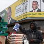 Man sells groceries behind Mnangagwa banner cost of living workers' salaries Government Should Do More - Youths Speak On Unemployment