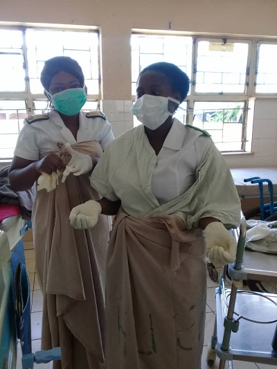 Nurses work with improvised PPEs