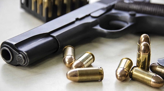 Gun - Ammunition armed robber shot dead shoot-out celebrations 25-year-old zimbabwean murdered 52-yeard-old robber arrested shootout